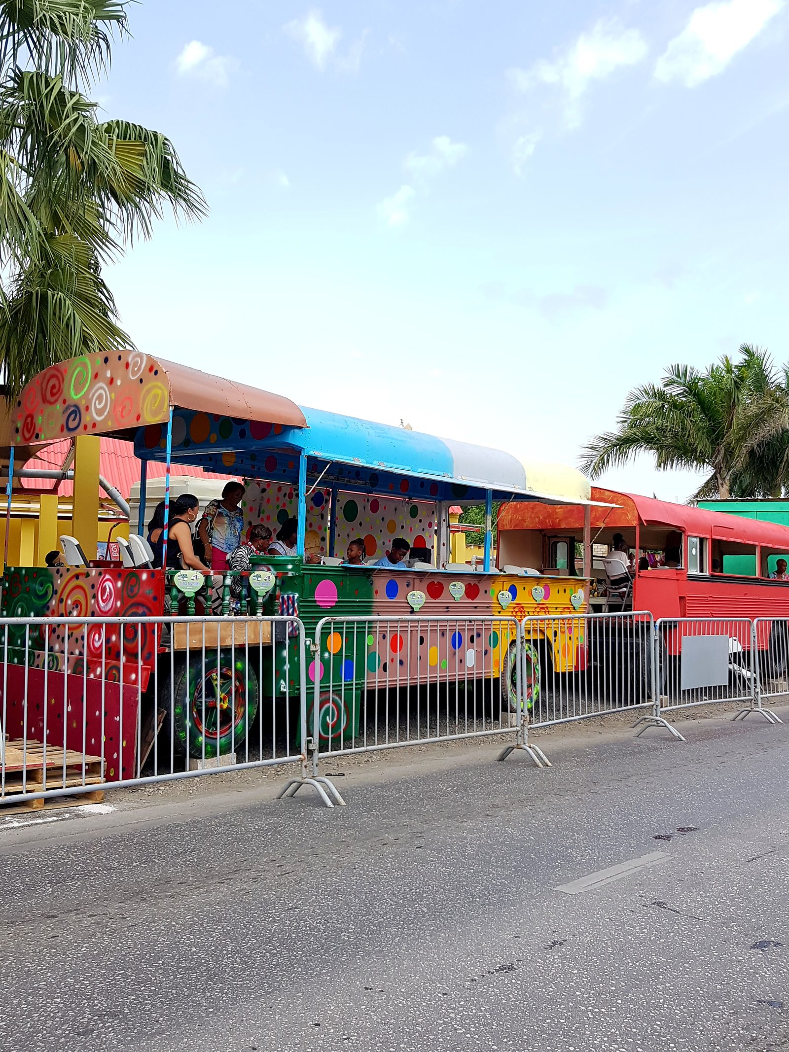 A Carnival float behind the route barriers, 2024