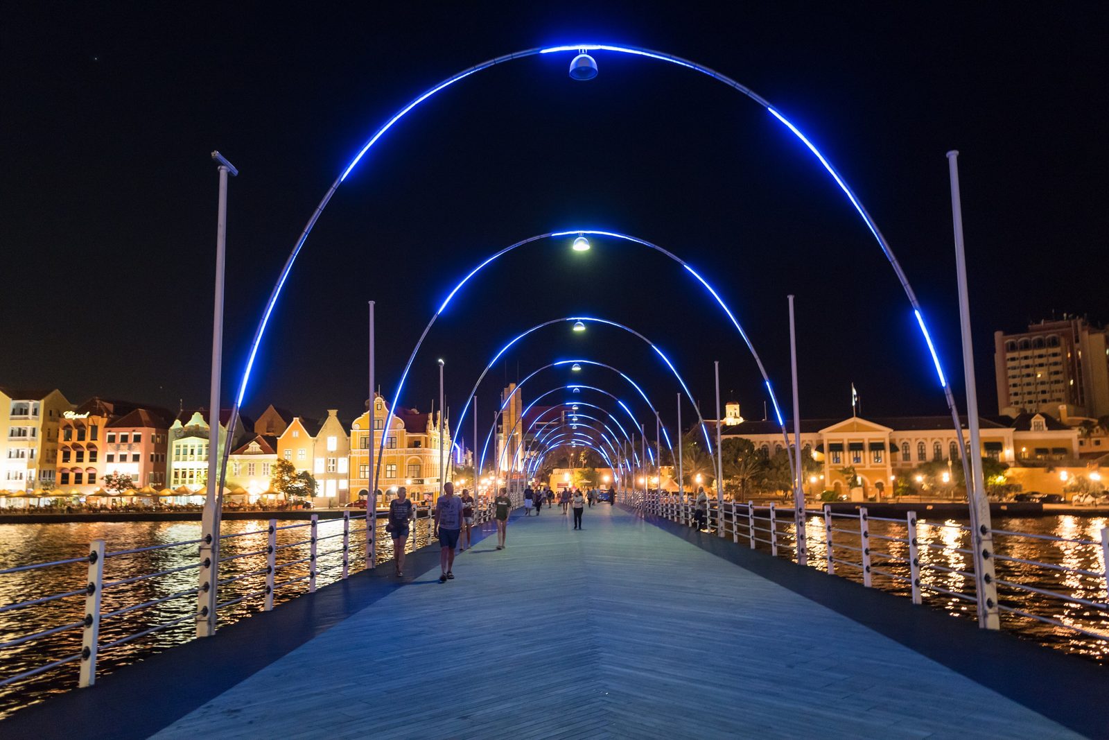 Queen Emma pontoon bridge lit up at night across St. Anna Bay, Willemstad