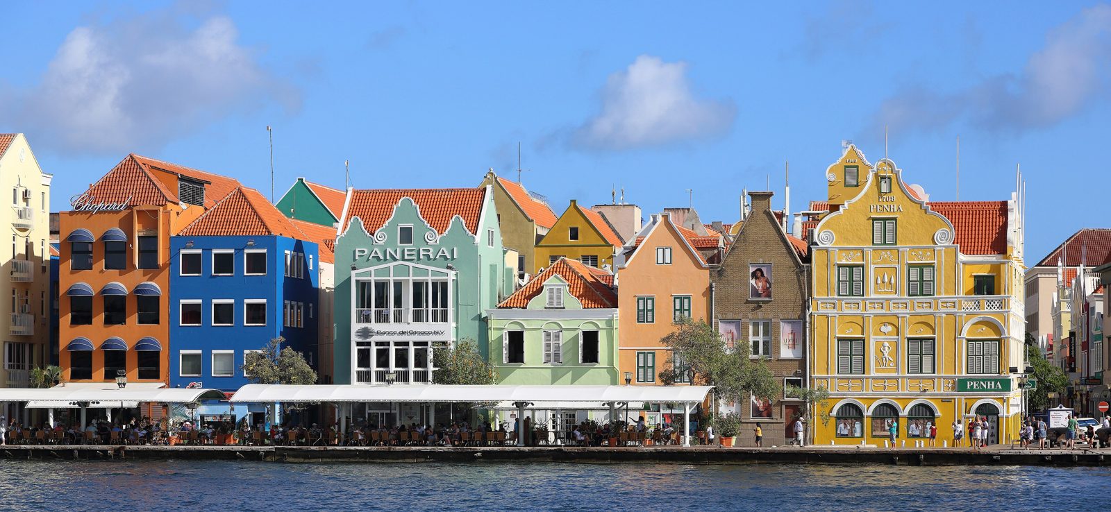 Colorful Dutch colonial facades along the Handelskade waterfront in Willemstad