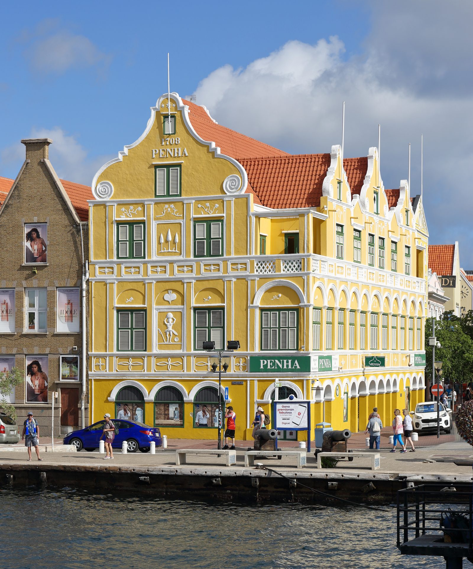 The yellow-and-white Penha building on the corner of Handelskade in Punda