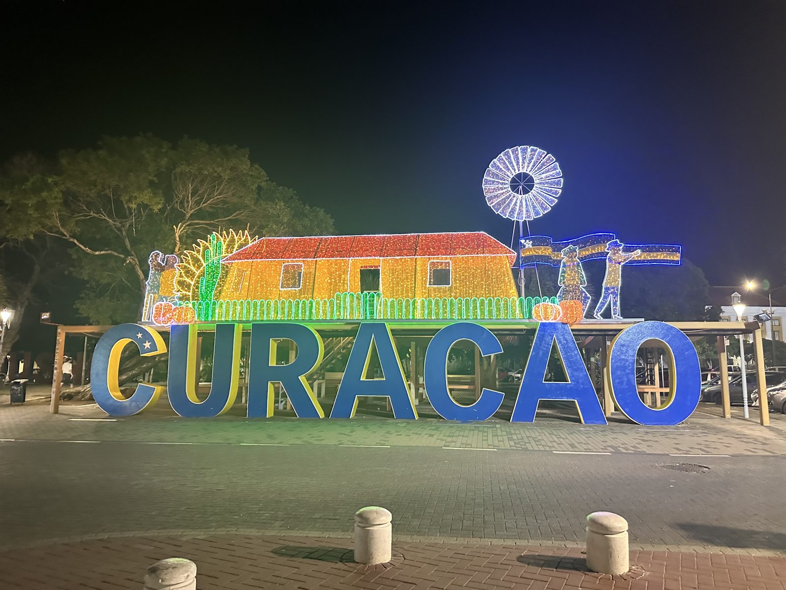 Holiday light displays behind the CURAÇAO letters in Willemstad
